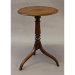 A VICTORIAN MAHOGANY OCCASIONAL TABLE, with a circular tip-top with moulded border on a turned