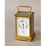 A BRASS CASED CARRIAGE CLOCK WITH ALARM, with a rectangular white enamelled dial with Roman numerals