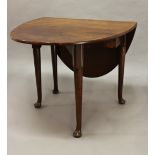 A GEORGE III MAHOGANY DROP FLAP TABLE, the oval top on turned legs and pad feet, 70cm high, the