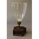A 19TH CENTURY STORM LANTERN, with a flared glass shade with 'turned over rim', brass candle