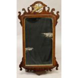 AN 18th CENTURY WALNUT 'FRET' WALL MIRROR, the rectangular plate within a gilt fillet and moulded