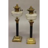 A NEAR PAIR OF CORINTHIAN COLUMN FORM TABLE LAMPS, with fittings by Hinks and Messenger, each with