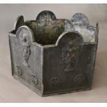 A VICTORIAN STYLE LEAD PLANTER, of hexagonal form, each side with a domed top and vase ornament,