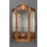 A LARGE LOUIS XVI STYLE KINGWOOD SERPENTINE FRONTED DISPLAY CABINET, the kingwood and ormolu mounted