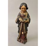 A PAINTED POLYCHROME SHRINE FIGURE, the female figure wearing red and green flowing dress and cloak,