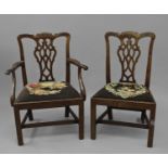 A SET OF SIX GEORGE III CHIPPENDALE STYLE DINING CHAIRS, four standard and two armchairs, each
