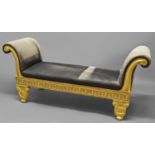 AN EMPIRE STYLE GILTWOOD SCROLL END OTTOMAN, the seat and arms upholstered in blue on a gilt frame