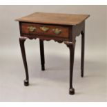 A GEORGE II STYLE MAHOGANY SIDE TABLE, the rectangular top with rounded corners above a single