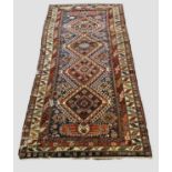 KUBA RUNNER, North East Caucasus, circa 1880. The indigo field with a column of stepped latch hook