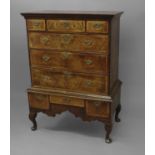 A GEORGE I WALNUT CHEST ON STAND, the upper section with three short drawers and three long