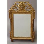 A 19TH CENTURY FRENCH GILTWOOD WALL MIRROR, with a rectangular mirror plate within a moulded