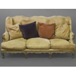 AN EARLY 19TH CENTURY FRENCH EMPIRE SETTEE, with a tall sloping back with multi-arched top, with