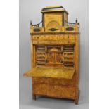 A BIEDERMEIER SATIN BIRCH AND EBONISED SECRETAIRE ABBATANT, of elaborate architectural form, the