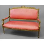 A NEO CLASSICAL LOUIS XVI STYLE SETTEE, with a rectangular back within a moulded surround surmounted