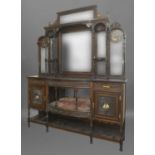 A FINE LATE VICTORIAN ROSEWOOD MIRROR BACKED SIDEBOARD, the elaborate back with a carved cresting