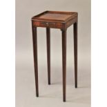 A GEORGE III STYLE MAHOGANY KETTLE STAND, the square top with raised border above a small slide,