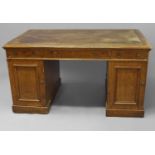 A VICTORIAN LIGHT OAK TWIN PEDESTAL PARTNERS DESK, with a broad rectangular leather lined top with
