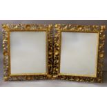 A PAIR OF ROCOCO STYLE WALL MIRRORS, each with rectangular plates within 'Florentine' style