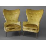ERNEST RACE - PAIR OF DESIGNER ARMCHAIRS a pair of DA1 metal framed wing armchairs, with button