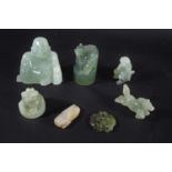 CHINESE JADE & JADEITE CARVINGS a mixed lot including a pale celadon and russet pendant in the