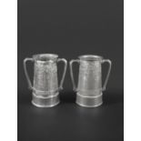 PAIR OF LIBERTY TUDRIC TWO HANDLED VASES designed by David Veasey for Liberty & Co, the pewter two