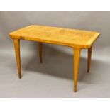 SWEDISH DESIGNER COFFEE TABLE with a rectangular shaped top with rounded corners, cross banded and