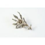 A VICTORIAN DIAMOND FOLIATE SPRAY BROOCH set overall with graduated old cushion-shaped and rose-