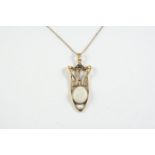 AN OPAL AND GOLD PENDANT the oval-shaped white opal is set within a 9ct gold openwork mount, 4.5cm