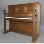 ARTS & CRAFTS PIANO - DALE FORTY an oak cased overdamped and straight strung iron frame piano,