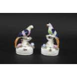 PAIR OF 19THC STAFFORDSHIRE INK POTS - BIRD a pair of polychrome painted Birds, resting on a tree