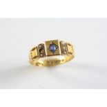 A VICTORIAN SAPPHIRE AND PEARL SET RING the 15ct gold mount is centred with an oval-shaped sapphire,