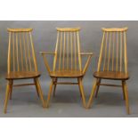 ERCOL DINING CHAIRS a set of four vintage light elm and beech stick back chairs (two carvers and two