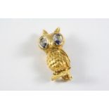 AN 18CT GOLD, SAPPHIRE AND DIAMOND OWL BROOCH realistically formed, the eyes set with circular-cut