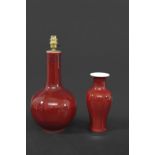 CHINESE SANG DE BOEUF VASE a porcelain baluster vase with an ox blood red glaze, unmarked (24cms