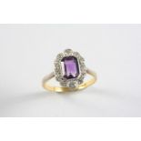 AN AMETHYST AND DIAMOND CLUSTER RING the cut cornered rectangular-shaped amethyst is set with a