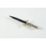 A SAPPHIRE AND DIAMOND 40 COMMANDO ROYAL MARINES DAGGER BROOCH mounted with calibre-cut sapphires