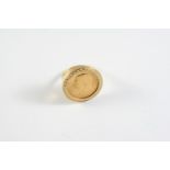 A GOLD SOVEREIGN 1915, in a 9ct gold ring mount, total weight 12.5 grams. Size Q