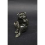 JAPANESE BRONZE MONKEY - SIGNED a late 19thc Meiji period bronze of a seated Monkey, with one hand
