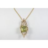 A GOLD, CITRINE AND DIAMOND PENDANT the gold abstract openwork mount centred with a large square-
