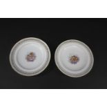 PAIR OF MEISSEN PLATES a pair of plates each with a central panel with a depiction of two Cherubs,