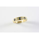 A DIAMOND AND SAPPHIRE HALF HOOP RING the four circular-cut sapphires are set with three brilliant-