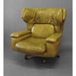 RETRO LEATHER SWIVEL CHAIR circa 1970's, a lime green leather chair of generous proportions and