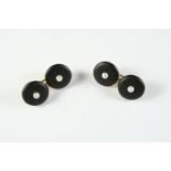 A PAIR OF BLACK ONYX AND PEARL CUFFLINKS each black onyx link centred with a small pearl, backed