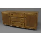 ERCOL SIDEBOARD a vintage light elm sideboard, with three central drawers flanked by cupboards on