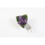 AN AMETHYST, DIAMOND AND NEPHRITE FOLIATE BROOCH formed with three carved amethyst flowerheads