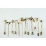 TWELVE ASSORTED STICK PINS including a green enamel, diamond and half pearl insect stick pin, a gold