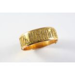 A LATE 19TH CENTURY RUSSIAN GOLD AND DIAMOND HALF HINGED BANGLE with embossed diamond set