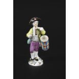 MEISSEN DRUMMER BOY a small figure of a Drummer Boy, brightly painted and playing an instrument.