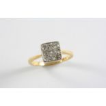 A DIAMOND CLUSTER RING the plaque shaped ring is millegrain set with graduated old circular-cut