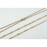 A GOLD ROPE LINK SLIDE NECKLACE the slide mounted with a circular white opal, 121cm long, 12.0